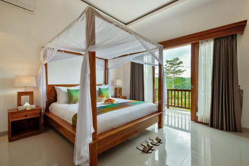 Katil atau katil-katil dalam bilik di Cenik Villa Ubud