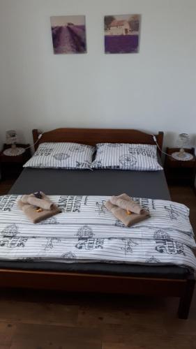 two beds in a room with candles on them at Ubytovanie na súkromí in Veľká Lomnica