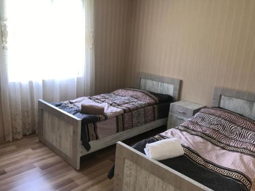 Postel nebo postele na pokoji v ubytování Maxvshi