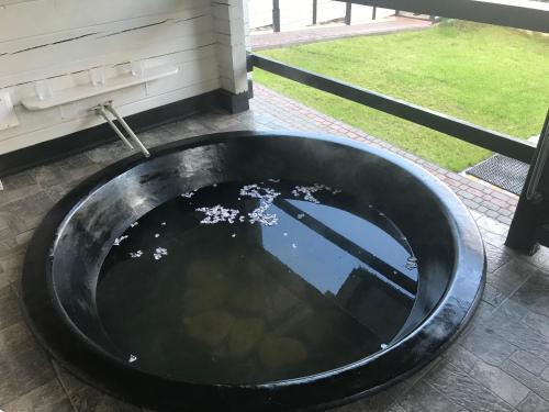a black sink in a bathroom with a window at Villa Medova in Kosiv