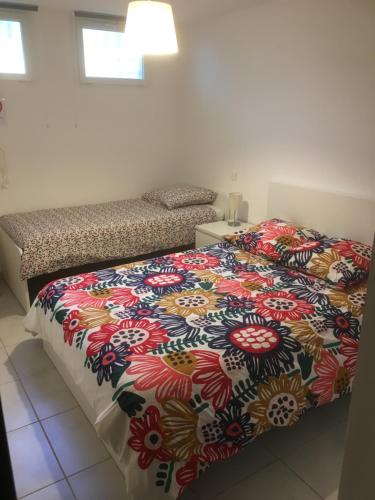 A bed or beds in a room at Gites Velaux Ecureuil et Pinède