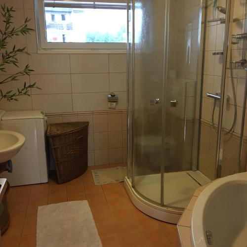 a bathroom with a shower and a sink at Apartment Tekeľova 95m2 in Prešov