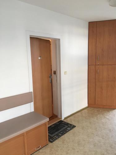 an empty room with a closet and a door at Apartment Tekeľova 95m2 in Prešov