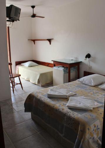 Postel nebo postele na pokoji v ubytování Lobo Hotel