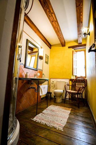 a bathroom with a sink and a toilet in a room at La Mora Cantana in Castrojeriz