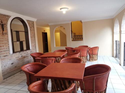 a row of tables and chairs in a restaurant at Hotel Boutique Real Tequila in Tequila