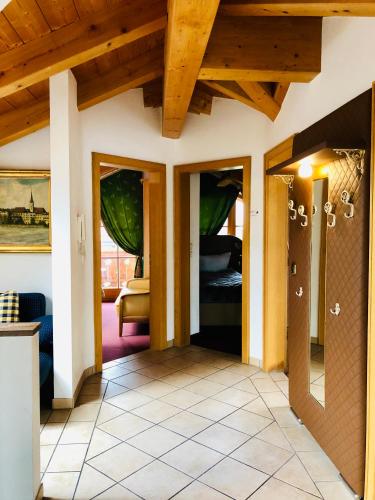a hallway of a house with wooden ceilings at Golden GaPa Penthouse 1 in Garmisch-Partenkirchen