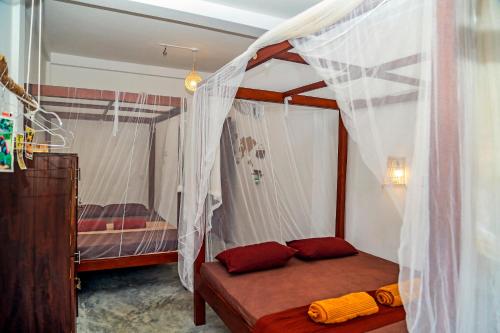 Postel nebo postele na pokoji v ubytování Chez Podi Surf Stay