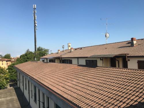 a building with a red tile roof at Mansardine Metropolitane in Brescia