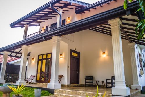 a home with awning and a front porch at BIVORA Villa in Negombo