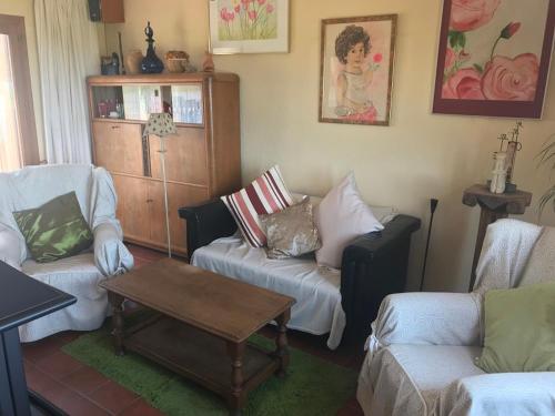 a living room with two couches and a coffee table at Mas Arboretum in La Pobla de Cérvoles