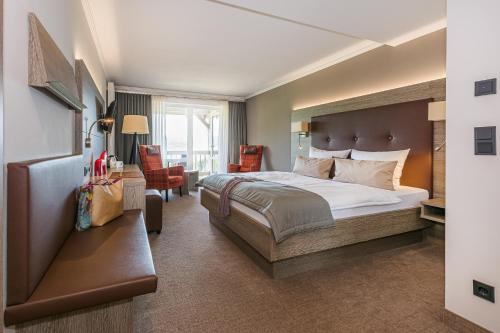En eller flere senge i et værelse på Romantik Hotel Ahrenberg