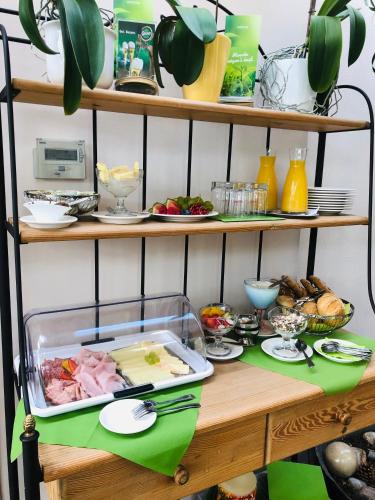 a table with a tray of food on a shelf at Konditorei Mandl in Bruck an der Mur