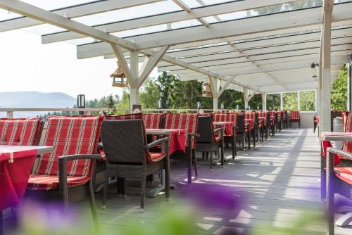 a row of tables and chairs on a patio at Romantik Hotel Ahrenberg in Bad Sooden-Allendorf