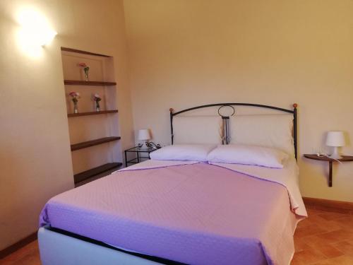 Łóżko lub łóżka w pokoju w obiekcie Casa Rigoletta