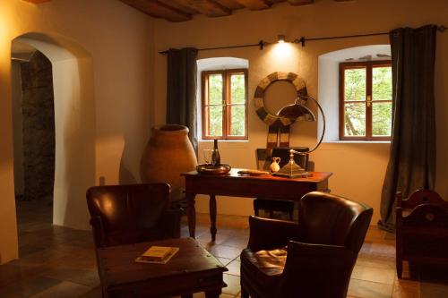 a living room with a table and a mirror at Living History (adults only) in Hallstatt