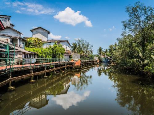 a river with houses and buildings on it at Artist's Place Trat in Trat