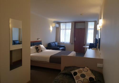 Ένα ή περισσότερα κρεβάτια σε δωμάτιο στο Argyle Motor Lodge