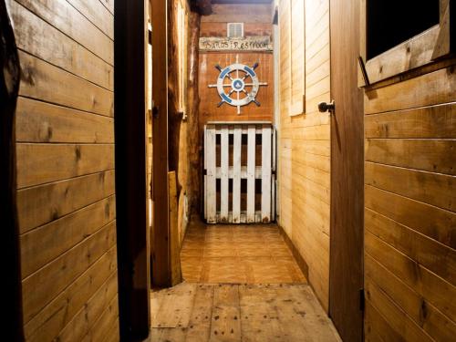 an empty hallway with a door in a building at Raw KokoMar PosadaNativa in Baru