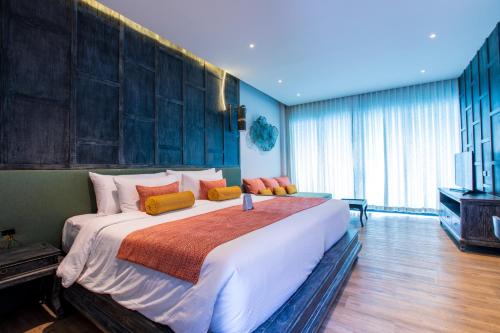 เตียงในห้องที่ Ananya Lipe Resort