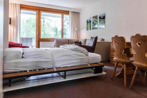 Postel nebo postele na pokoji v ubytování Residenz Alpina im Kurhaus