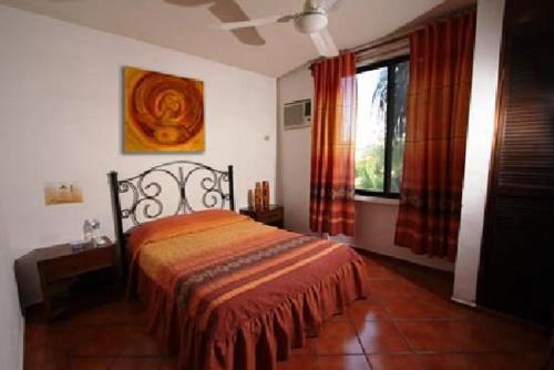 Säng eller sängar i ett rum på Hotel Los Girasoles