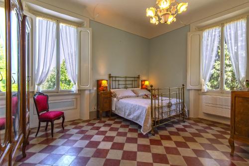 Ένα ή περισσότερα κρεβάτια σε δωμάτιο στο Agriturismo Villa Ulivello in Chianti