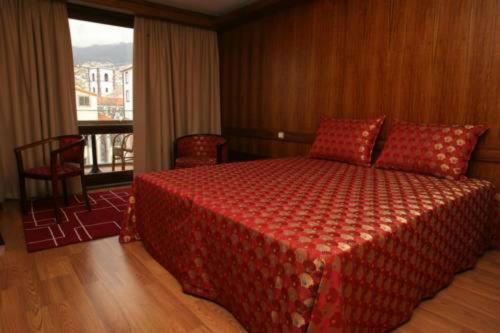 מיטה או מיטות בחדר ב-Hotel Catedral