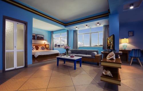 Ένα ή περισσότερα κρεβάτια σε δωμάτιο στο Sanya Tropical Coast Hotel