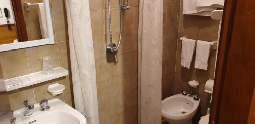 a bathroom with a sink and a toilet at Hotel Anselmi in Marciana Marina