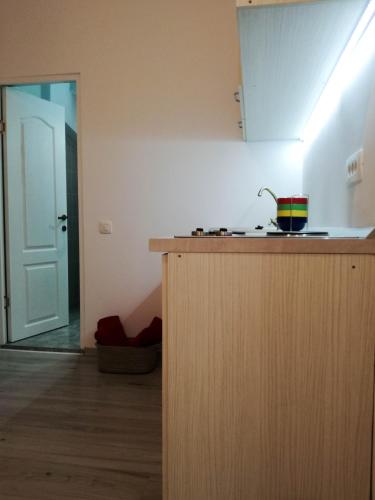 a kitchen with a counter with a rainbow bowl on it at BrasovApart Piata Sfatului 1 in Braşov