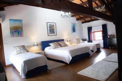 A bed or beds in a room at Palazzo Strassoldo bed & breakfast