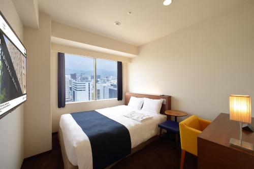 Ένα ή περισσότερα κρεβάτια σε δωμάτιο στο Oriental Hotel Hiroshima