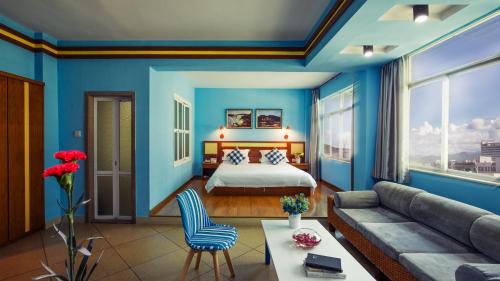 Ένα ή περισσότερα κρεβάτια σε δωμάτιο στο Sanya Tropical Coast Hotel
