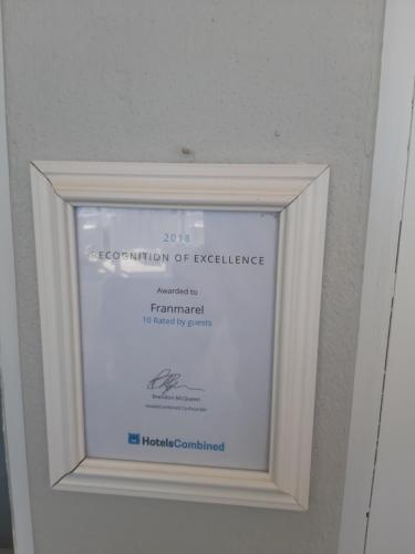 a framed picture of the institution of excellence at Franmarel in Plettenberg Bay