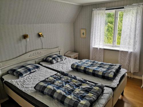 Postel nebo postele na pokoji v ubytování STF Hagaby/Lantgården Hostel