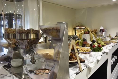 a buffet with many different types of food on a table at BUSINESS HOTEL SFAX in Sfax