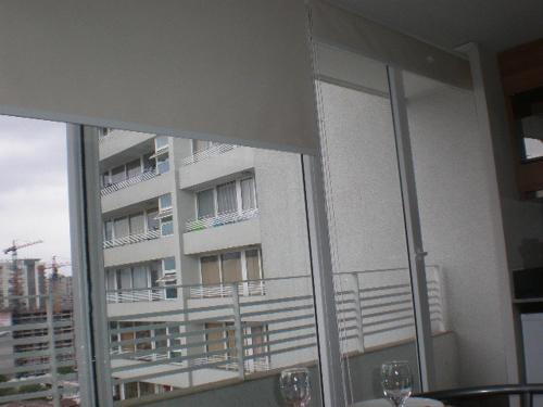 a view of a building from a window at Zenteno Apartments in Santiago