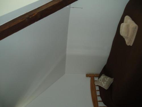 a small room with a bunk bed and a ladder at The Old Forge Seafood Restaurant and Bed and Breakfast in Thursford