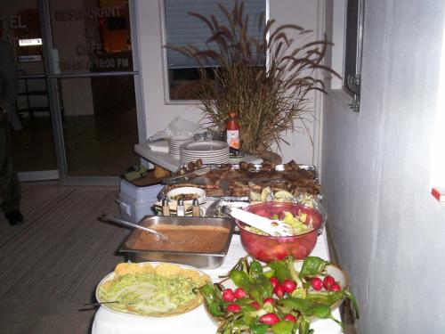 a table with many different types of food on it at Eco Bay Hotel in Bahía Kino