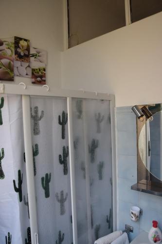 Kylpyhuone majoituspaikassa In Centro Apartment