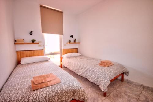 Llit o llits en una habitació de Bonito Apartamento 105