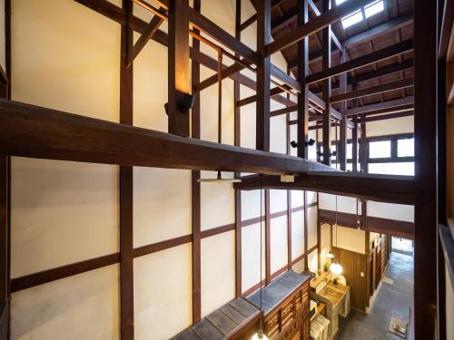 an overhead view of a building with wooden beams at Inase Otsu Machiya Bed and Breakfast in Otsu