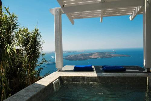 a swimming pool with a view of the ocean at Iatis View Collection in Imerovigli