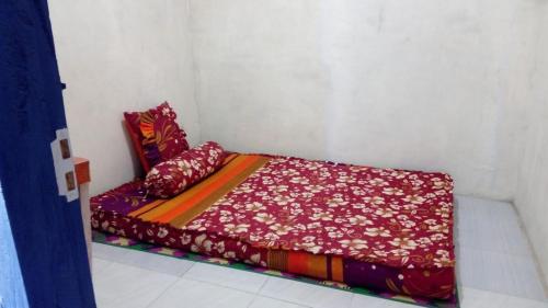 Postel nebo postele na pokoji v ubytování Mudung Keramat Homestay