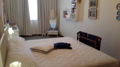 a bedroom with a large white bed in a room at Bougain Villa Guesthouse in Prince Albert