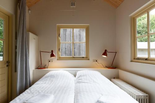 Кровать или кровати в номере Bosvilla Kennemerduinen