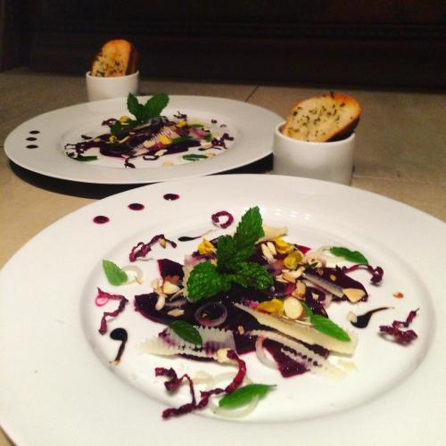 two plates of food sitting on a table at El Refugio La Brisa del Diablo in Valle Hornito