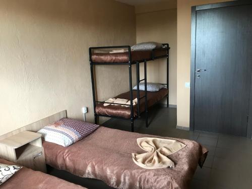 Postel nebo postele na pokoji v ubytování Mini gostinitsa HOSTEL