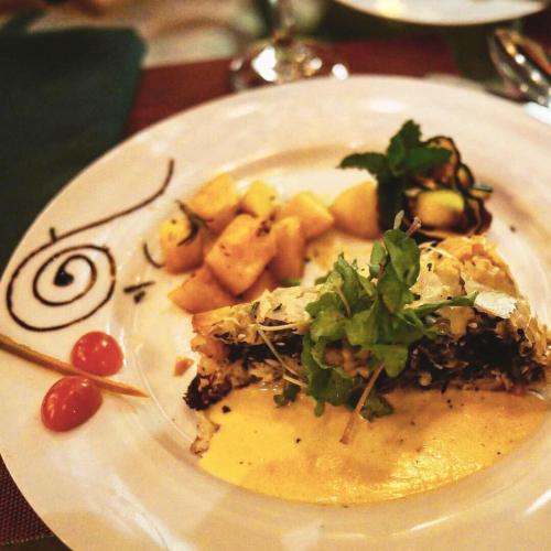 a white plate of food on a table at El Refugio La Brisa del Diablo in Valle Hornito